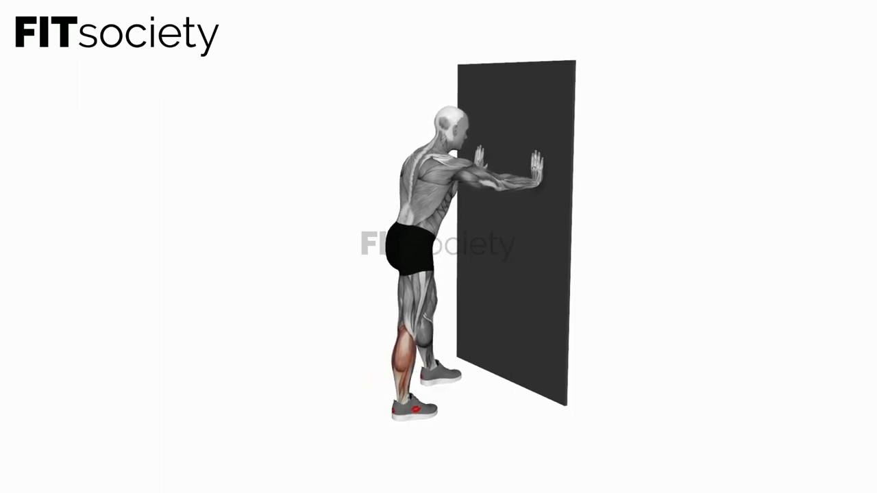 Wadenstretch mit den Händen an der Wand